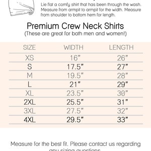 May include: A chart showing size measurements for premium crew neck shirts. The chart lists sizes XS through 4XL with corresponding width and length measurements in inches.