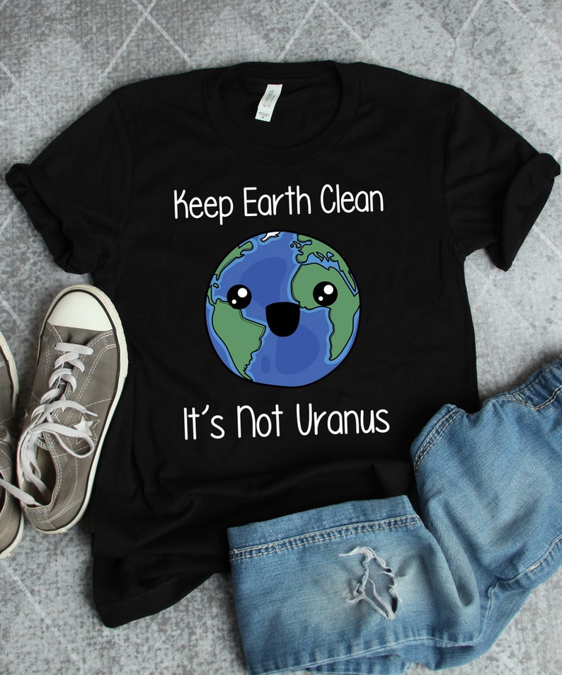 May include: Black t-shirt with a white graphic of a smiling cartoon Earth with the text "Keep Earth Clean It's Not Uranus".