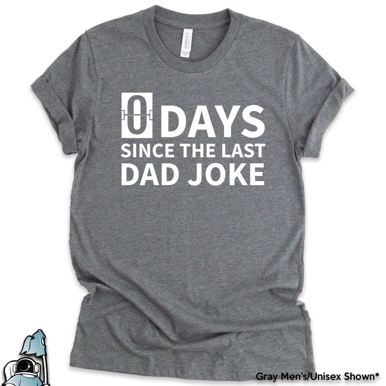 K&ouml;nnte beinhalten: Graues T-Shirt mit wei&szlig;em Text, der "0 TAGE SEIT DEM LETZTEN VATER WITZ" lautet.