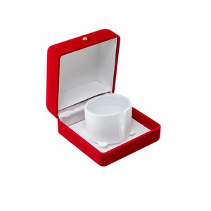 May include: Red velvet jewellery box with a white velvet interior and a white foam insert for a bracelet.