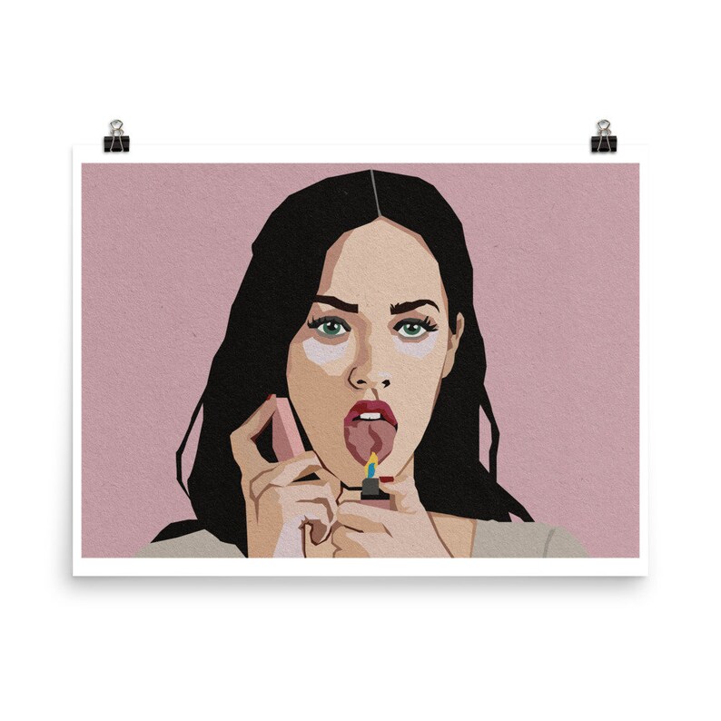 May include: Art print featuring a stylized portrait of a person with dark hair and green eyes. The person is holding a lighter to their tongue, with a pink background. The art style is graphic and bold.