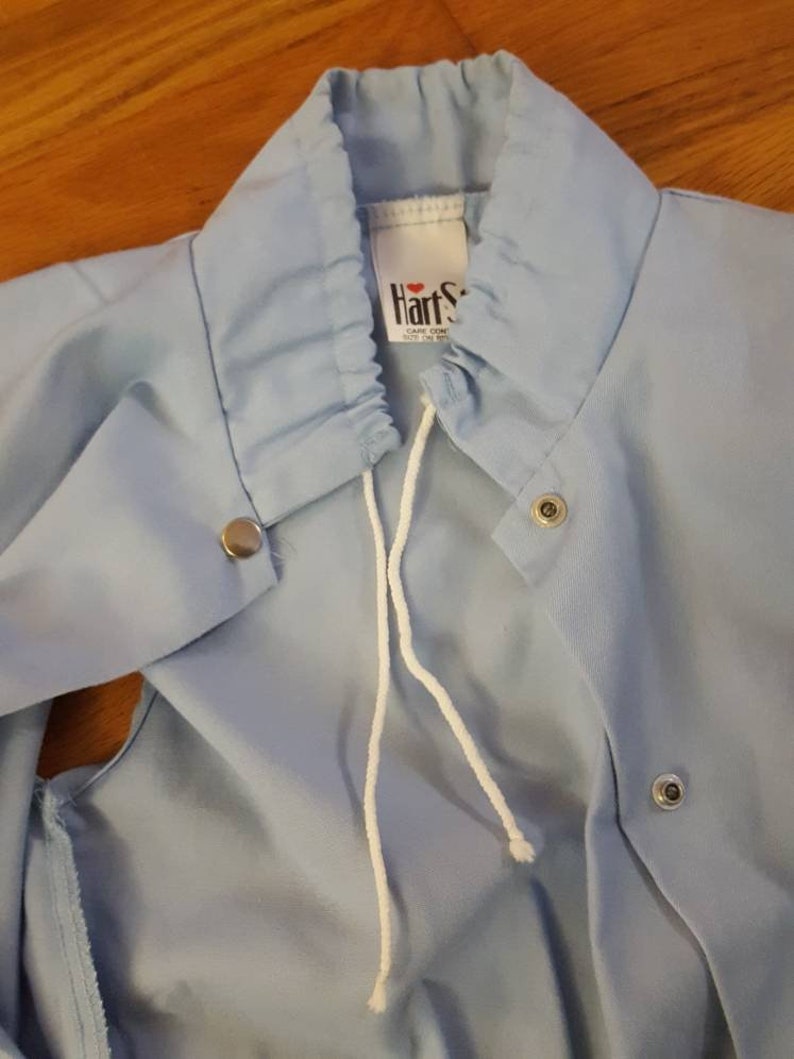 Retro light blue snap button up hoodie-less vest with neck drawstring