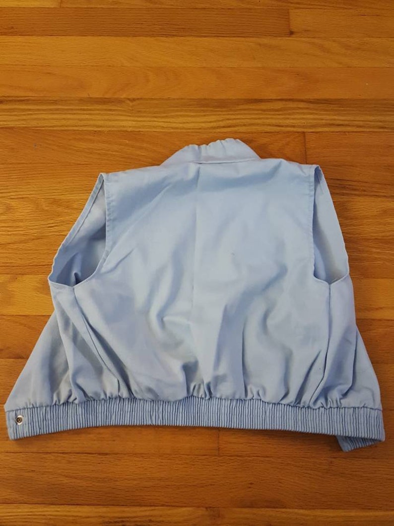 Retro light blue snap button up hoodie-less vest with neck drawstring