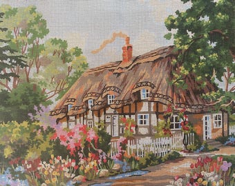 May include: A thatched-roof cottage with white walls and windows, surrounded by lush green trees and colorful flowers. The cottage has a white picket fence and a stone path leading to the front door.