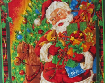 May include: Santa Claus holding a teddy bear and a stack of wrapped gifts in front of a Christmas tree with a rocking horse. The background is a red and green plaid pattern with holly.