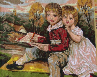 May include: Two children, a boy and a girl, sit on a grassy knoll with a book in their laps. The boy is wearing a red shirt and brown pants, while the girl is wearing a white dress. The background is a colorful landscape with trees and a distant town.