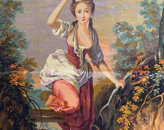 May include: A tapestry depicting a woman in a red and white dress carrying a copper pot on her head. The scene is set in a landscape with trees, a fence, and a basket. The color palette includes shades of red, brown, and blue.