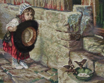 May include: A young girl in a red and white dress holds a black hat in front of her. She is standing on a stone path with a stone wall behind her. There are two birds in a nest to the right of the girl.