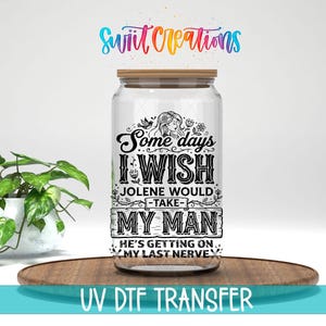 May include: A clear glass tumbler with a bamboo lid featuring a black graphic design that reads: Some days I WISH JOLENE WOULD TAKE MY MAN HE'S GETTING ON MY LAST NERVE, decorated with floral accents and a small bird illustration.