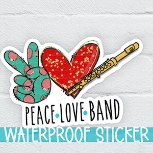 May include: Peace Love Band waterproof sticker with a peace sign, a red heart with gold glitter, and a gold flute.