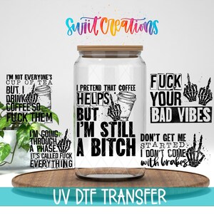 The image is a collage of various text and graphics, including a large text that reads "I pretend that coffee helps me" and smaller text that says "FUCK YOUR BAD VIBES". There are also images of skeletal hands and a coffee cup, along with other text and graphics. The image does not contain any specific information about the content or context, and it does not describe each individual element in detail. The image is described as a "UV DFT TRANSFER" and is not a single image.
