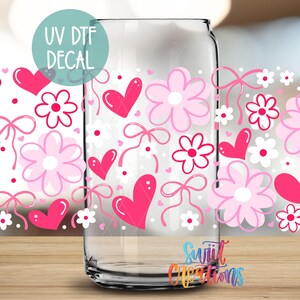a clear glass jar with a floral pattern and hearts printed on it, along with a UV decal.