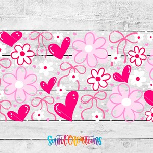 The image is a collage of various pink and white floral and heart designs arranged on a wooden background.