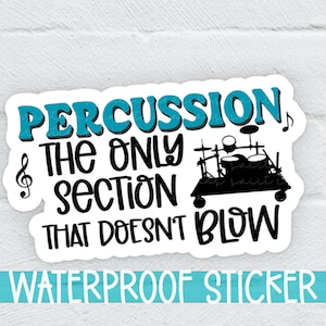 May include: A white sticker with a blue and black design. The sticker says "Percussion, the only section that doesn't blow" with a drum set graphic and musical notes. The sticker also says "Waterproof Sticker" at the bottom.