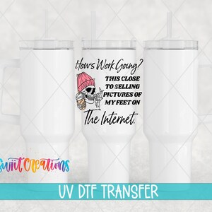 The image is a digital transfer of a design featuring a skeleton wearing a pink hat and holding a drink, with text overlaying the image.