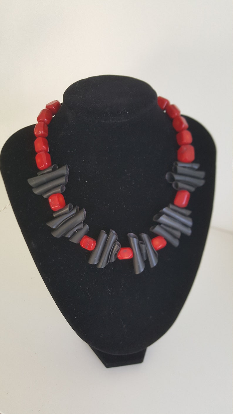 Upcycling necklace in black and red made from inner bike tube and recycled beads