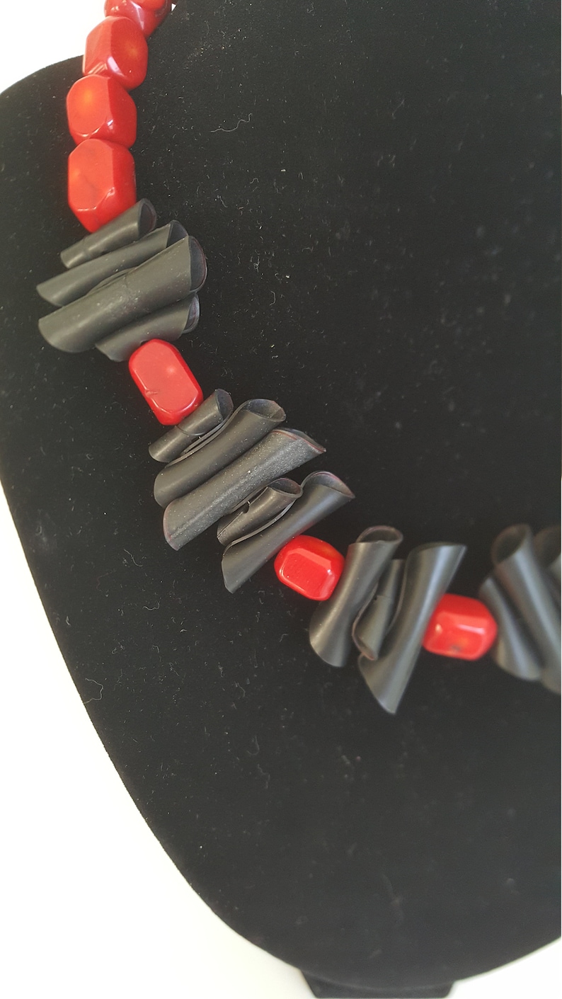 Upcycling necklace in black and red made from inner bike tube and recycled beads