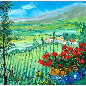 May include: A painting of a landscape with a village in the distance, a field of green vines in the foreground, and a cluster of red flowers in a pot.