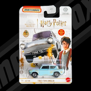 May include: A Matchbox toy car package featuring a light blue 1962 Ford Anglia from the Harry Potter series. The package includes an image of Harry Potter and the text "NEW NOUVEAU 2024". The car is 42 of 100 in the series.