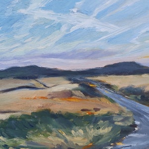 May include: A painting of a landscape with a road leading into the distance. The sky is a light blue with white clouds, and the ground is a mix of brown and green. The road is a light gray color.