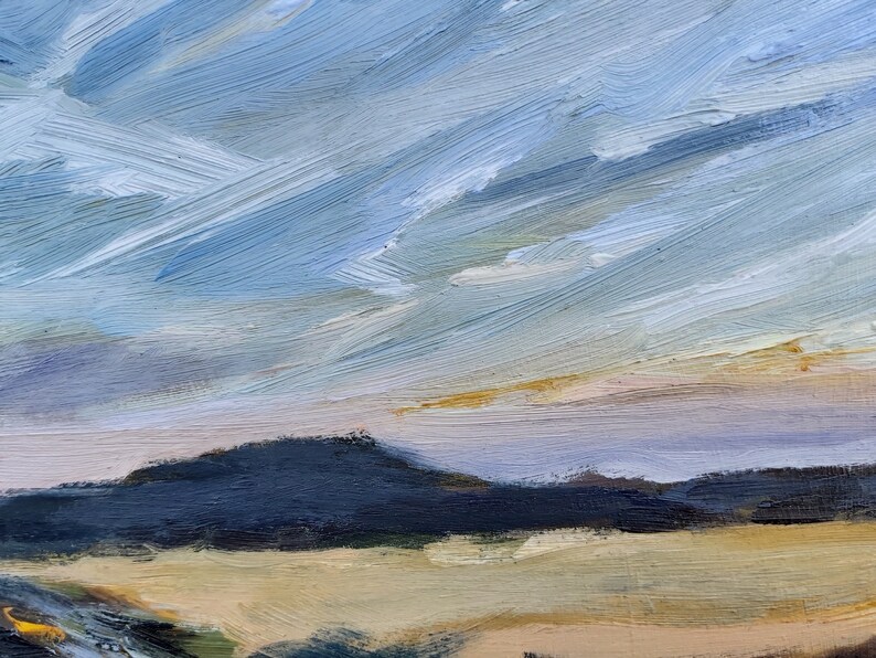 May include: A painting of a landscape with a blue sky and a dark mountain range in the distance. The sky is painted with thick, white brushstrokes, and the mountains are painted with dark blue brushstrokes.