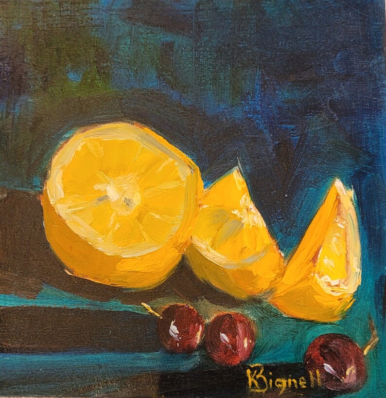 May include: A still life painting of three orange slices and three red cherries on a dark blue background. The painting is signed "K. Bignell".
