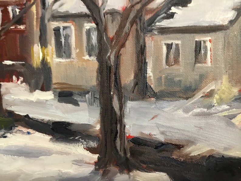 May include: A painting of a snowy street scene with a tree in the foreground. The tree has two trunks and is painted in shades of brown. The houses in the background are painted in shades of gray and white.