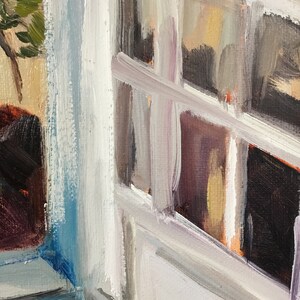 May include: A close-up of a white painted window with a blue painted frame. The window is open and the glass panes are visible. The paint is textured and has a brushstroke effect.