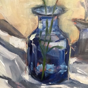 May include: A still life painting of a cobalt blue glass vase holding green stems. The vase is set against a backdrop of soft, neutral tones and a white cloth. The artwork is rendered with visible brushstrokes.