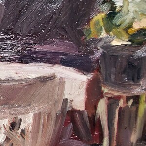 May include: A close-up of a still life painting featuring a potted plant with white flowers, a white table cloth, and a dark brown background.