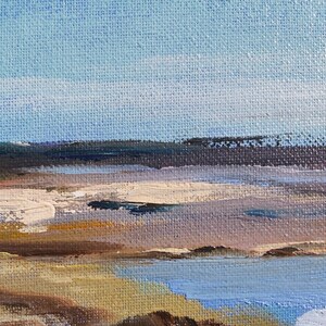 May include: A painting of a seascape with a blue sky, white clouds, and a brown shoreline. The water is a light blue color and the sand is a light brown color.