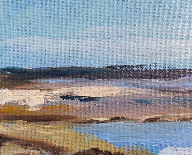 May include: A painting of a seascape with a blue sky, white clouds, and a brown shoreline. The water is a light blue color and the sand is a light brown color.