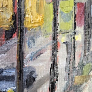 May include: Impressionistic oil painting depicting a street scene with buildings and streetlights. The artwork features thick brushstrokes and a palette of yellow, green, red, and gray. The painting captures the essence of a city landscape.