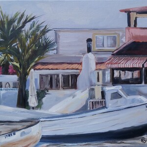 May include: A painting of a white boat docked at a harbor with a white building and palm tree in the background. The boat has the number B3670LS on the side. The painting is signed by the artist, Bignell.