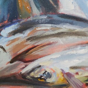 May include: Close-up of a painting of an eye with a dark blue iris and a yellow and white sclera. The eye is surrounded by strokes of red, brown, and white paint.