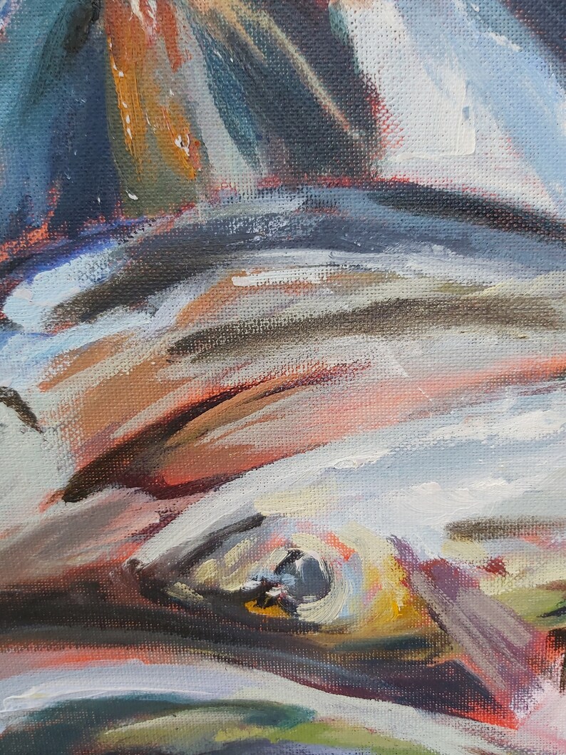 May include: Close-up of a painting of an eye with a dark blue iris and a yellow and white sclera. The eye is surrounded by strokes of red, brown, and white paint.