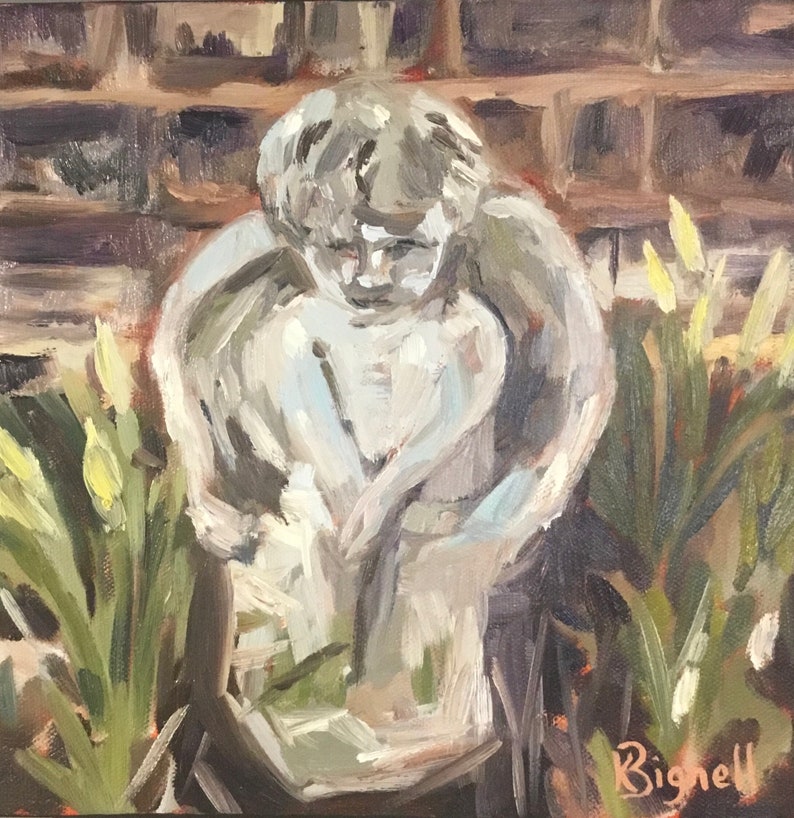 May include: A white stone angel statue with wings, sitting in a garden setting with green foliage and yellow flowers. The statue is weathered and has a distressed look. The artist's signature, "Bignell", is visible in the lower right corner.