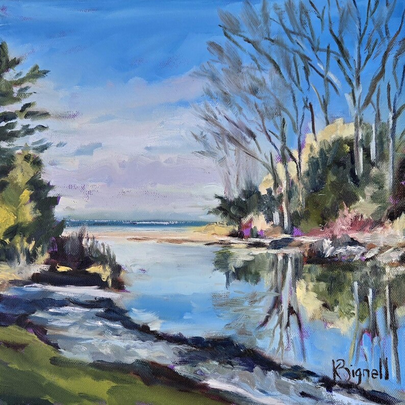 May include: A painting of a calm, blue lake with a sandy shore and trees on either side. The sky is a bright blue with white clouds. The water reflects the trees and sky.