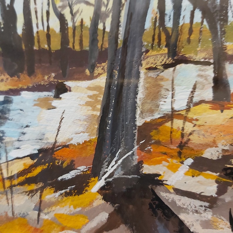 May include: A painting of a forest scene with a river in the foreground. The trees are painted in shades of brown and black, and the river is a light blue color. The ground is covered in fallen leaves and branches.