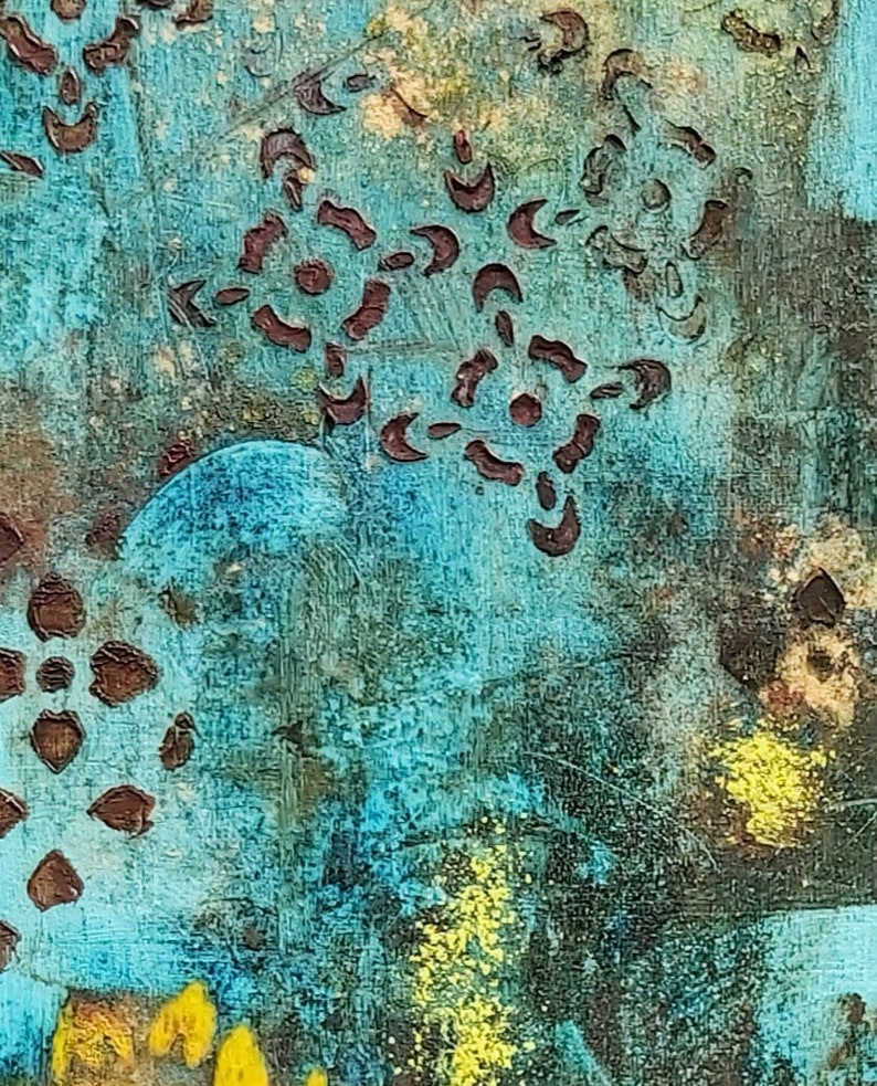 May include: Abstract painting with a blue background and brown and yellow accents. The painting features a pattern of brown shapes that resemble flowers or stars.