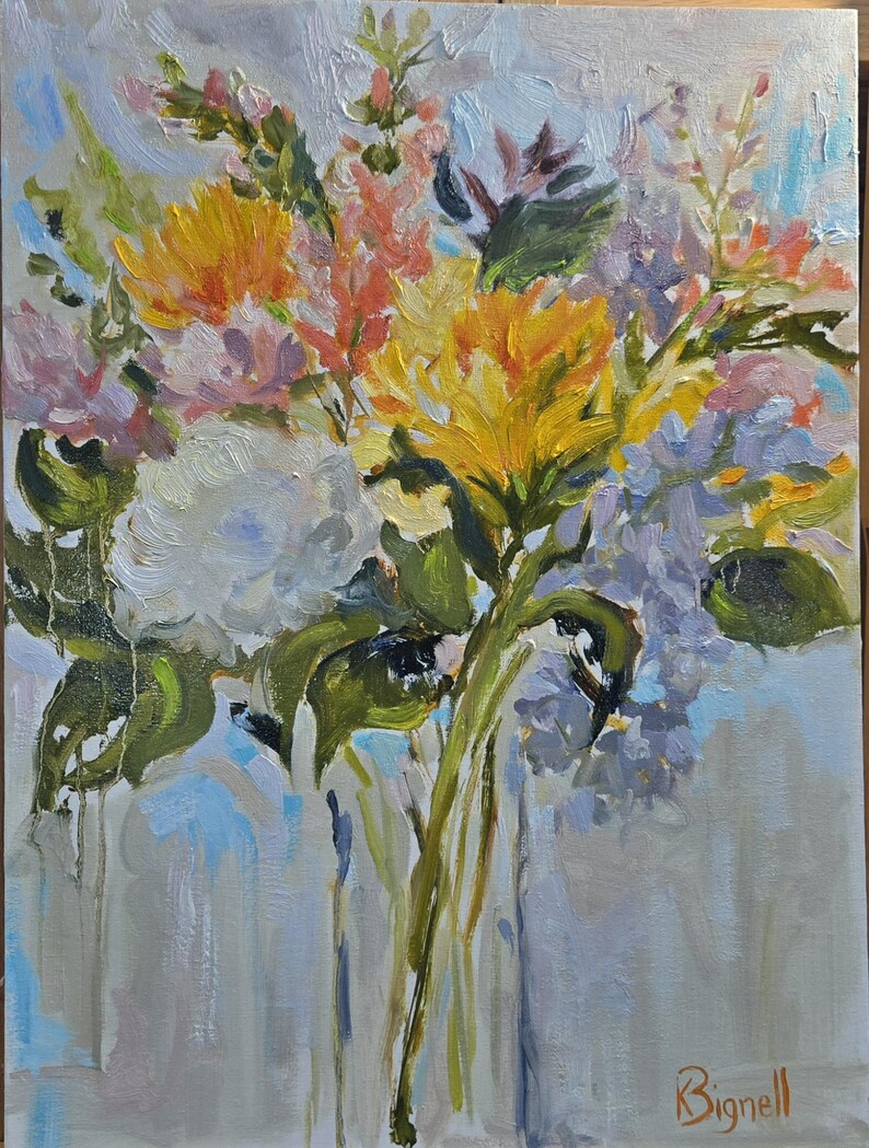 May include: An original oil painting of a vibrant floral arrangement. The artwork features yellow, white, pink, and purple flowers with green leaves against a light blue and gray background. The artist's signature, "Bignell," is visible in the lower right corner.