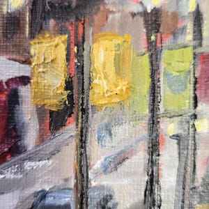 May include: Impressionistic oil painting depicting a city street scene. The artwork features textured brushstrokes and a palette of yellow, gray, red, and black. Two yellow rectangular shapes are prominent, possibly representing streetlights.