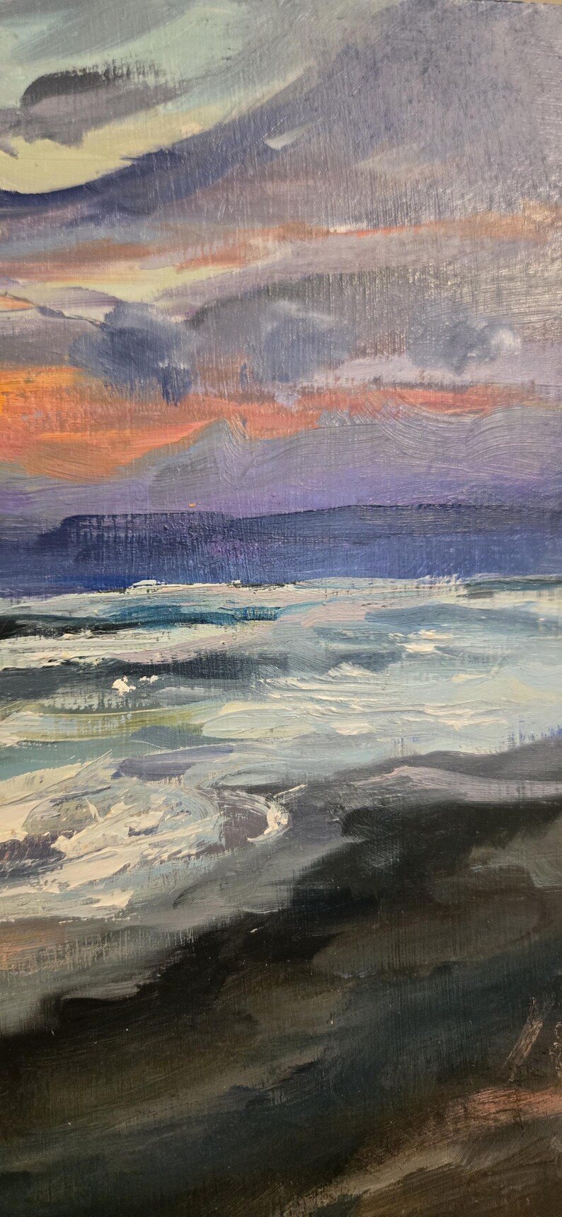 May include: An oil painting depicting a seascape at sunset. The sky transitions from orange to purple and blue, with dark clouds. The ocean has white waves and a dark shoreline.