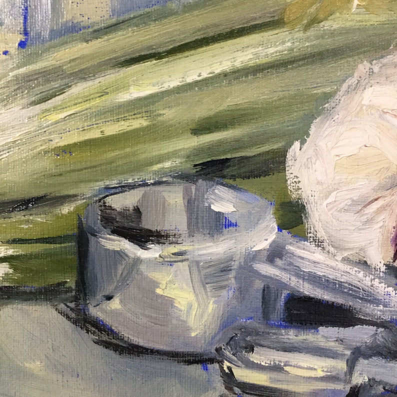 May include: Oil painting of a still life featuring a silver metal cup and a white flower. The background has green and yellow brushstrokes. The painting has a textured, impressionistic style.
