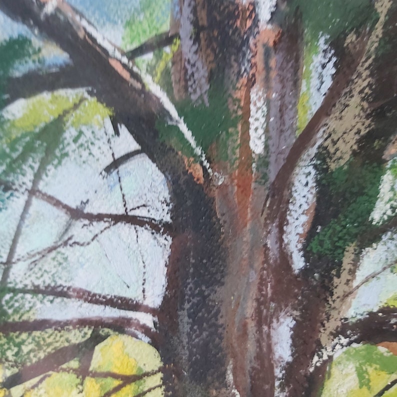 May include: A close-up of a tree trunk with branches reaching up towards the sky. The bark is a mix of brown, green, and white, and the branches are a dark brown. The background is a light blue sky.