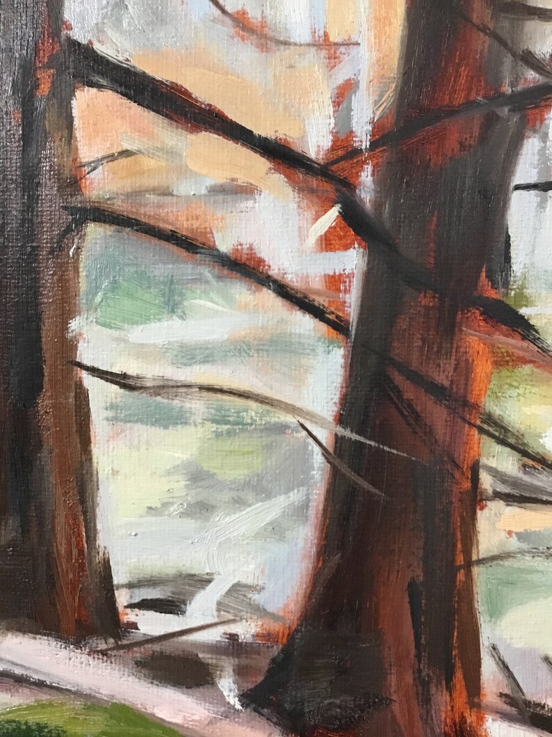 May include: A painting of two brown tree trunks with branches in the foreground. The background is a blurry, light blue and white landscape.