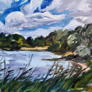 May include: An oil painting of a serene landscape featuring a body of water under a cloudy sky. Lush green trees line the shore, with tall grass in the foreground. The artwork uses a palette of blues, greens, and whites to depict a natural scene.