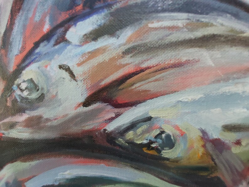 May include: Close-up of a painting of fish with blue, gray, and brown tones. The fish are painted with thick brushstrokes and have visible scales. The painting is abstract and impressionistic.