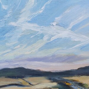 May include: A painting of a landscape with a blue sky and white clouds. The sky is painted with long, horizontal strokes of blue paint. The clouds are white and fluffy, and they are painted with short, vertical strokes of white paint. The landscape is painted in shades of green and brown, and it is painted with short, horizontal strokes of paint.