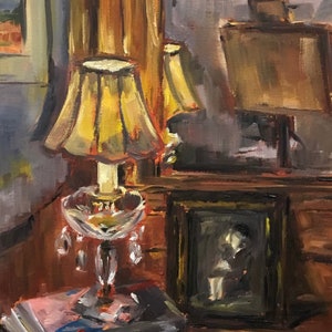 May include: A painting of a still life with a lamp, books, and a framed photo. The lamp has a yellow shade and a crystal base. The books are stacked on a table, and the photo is of a person sitting in a chair. The painting is done in a loose, impressionistic style.
